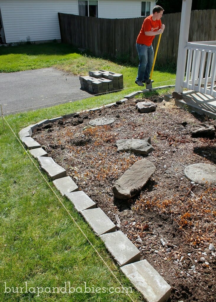 Putting the concrete brick for DIY retaining wall
