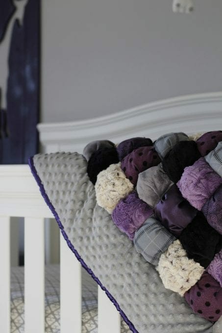 Handmade purple baby quilt image.