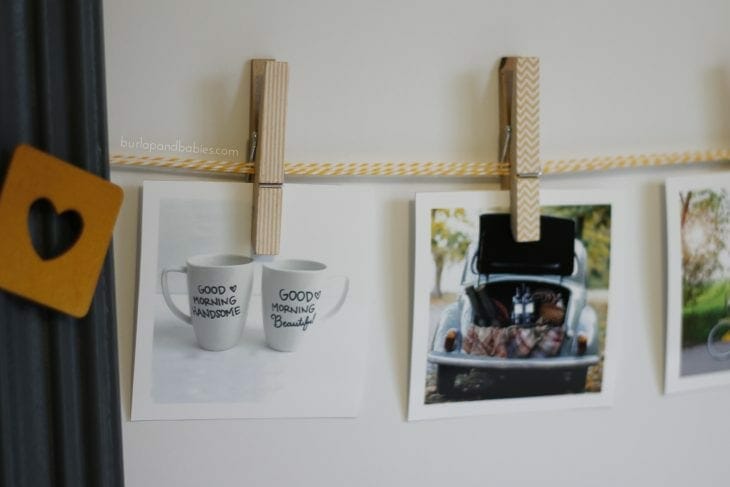 Photos displayed on a rope with clothespins image.