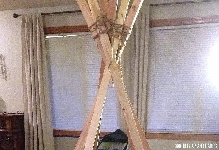 Wooden pieces forming a teepee image. 