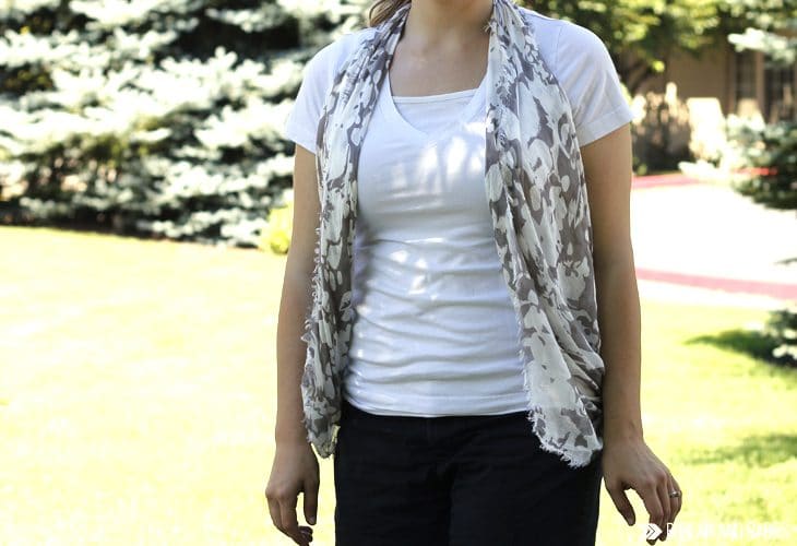 Woman wearing a white t-shirt with a scarf tied into a vest image.