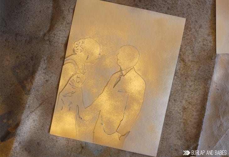 Create this DIY Wedding Picture Silhouette for a traditional first anniversary gift using paper! | Anyone can make a stunning silhouette using one of your favorite wedding photos and an exacto knife. Find out how to make it here + 10 additional paper gift ideas! 