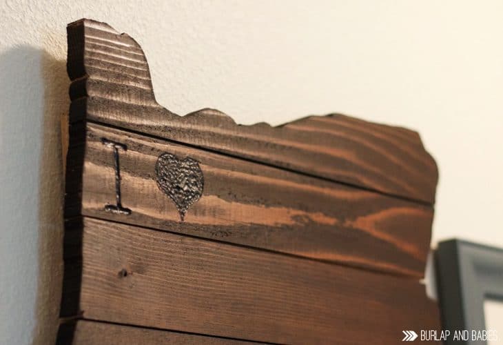 Wooden wall art in the shape of a state image.