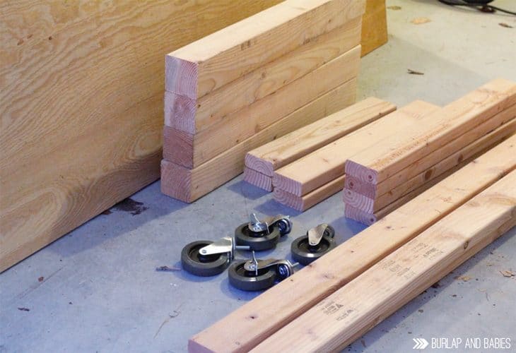 Pieces of wood and rollers for building a workbench image.