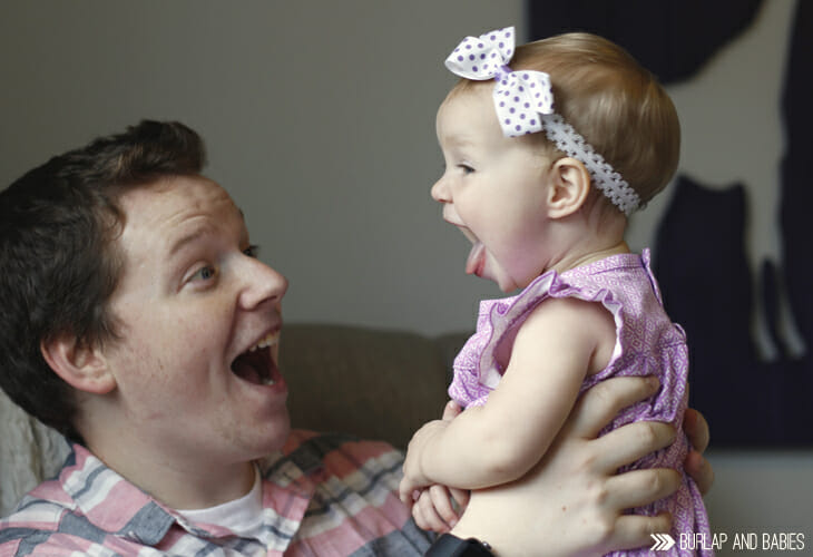 Dad and baby girl smiling image.
