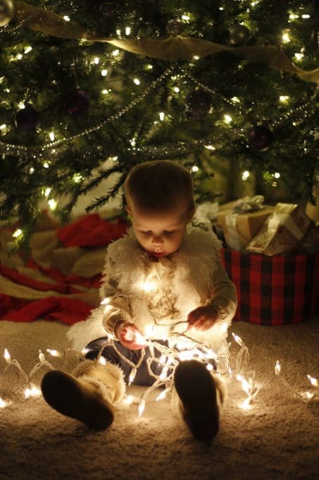 Take an adorable photo of your baby or toddler this year with Christmas lights. Great memories to have with your kids!