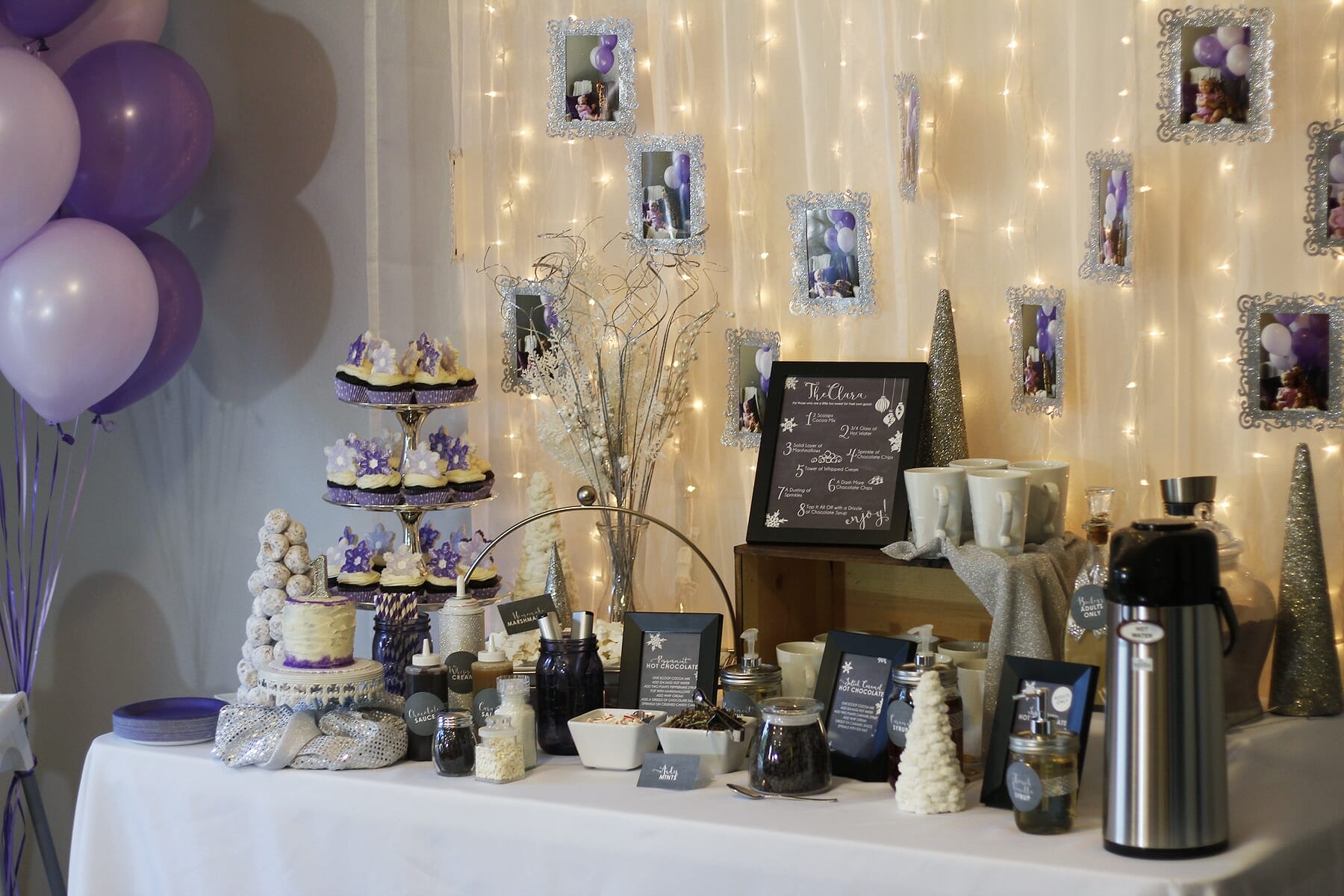 Winter Wonderland Hot Chocolate Bar with DIY frames hung over twinkly lights image.