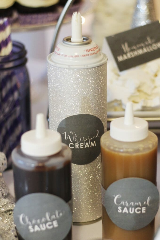 Whipped cream can wrapped in sparkle paper for hot chocolate bar party favors image.