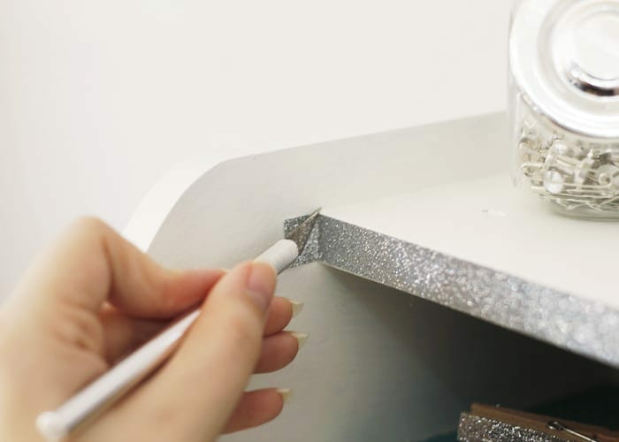 Hand cutting washi tape with exacto knife image.