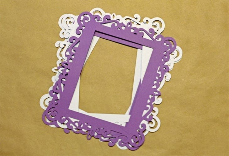 Purple and white cardstock in the shape of frames image.