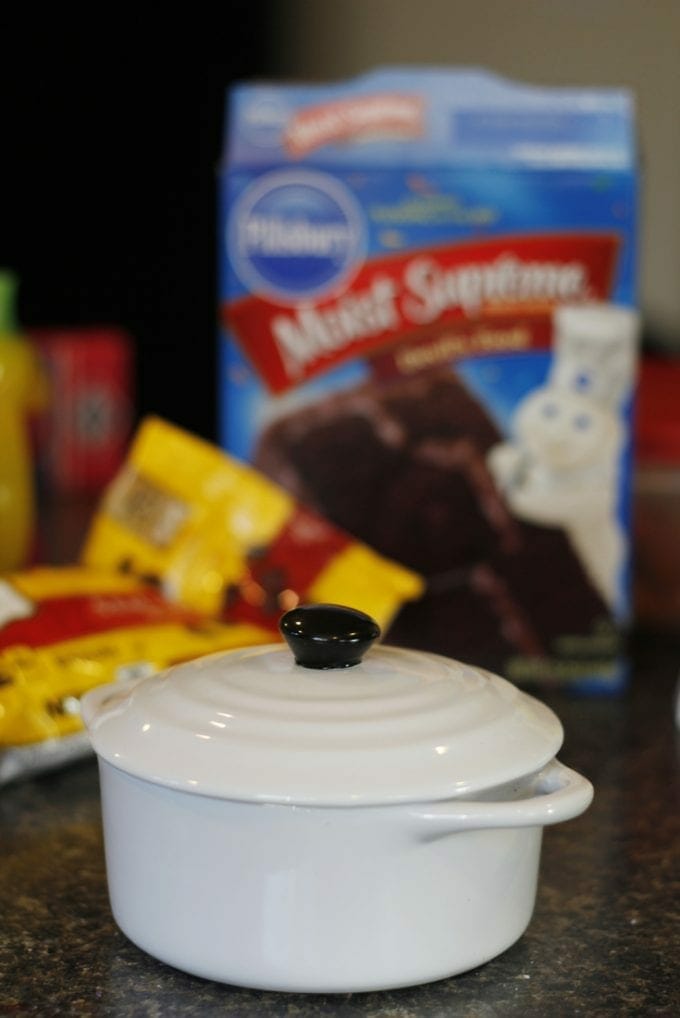Cake mix, chocolate chips and small white pot image.