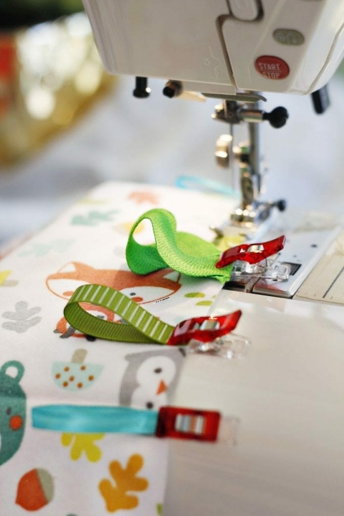 Sewing a tag blanket image.