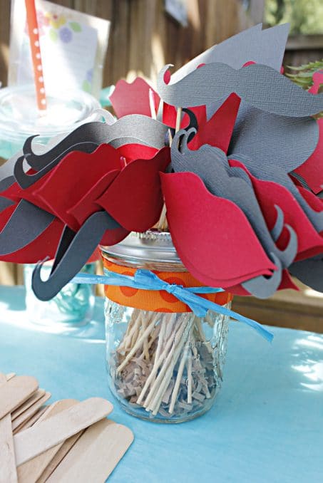 Host a beautiful backyard bridal shower full of lots of DIY ideas, decorations, finger food recipes, and fun games. This lips and mustaches were the perfect addition to the 