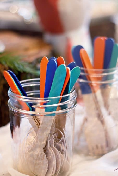 Wooden sticks dipped in orange and shades of blue image.