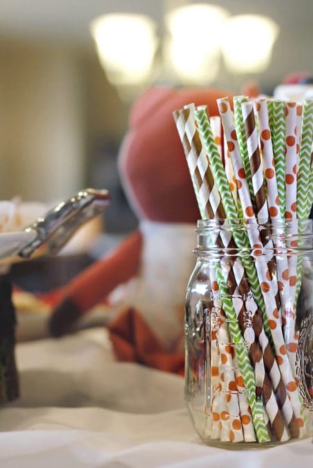 Colorful paper straws in a clear jar image.