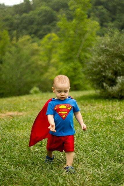 Little boy in DIY Superman costume image.