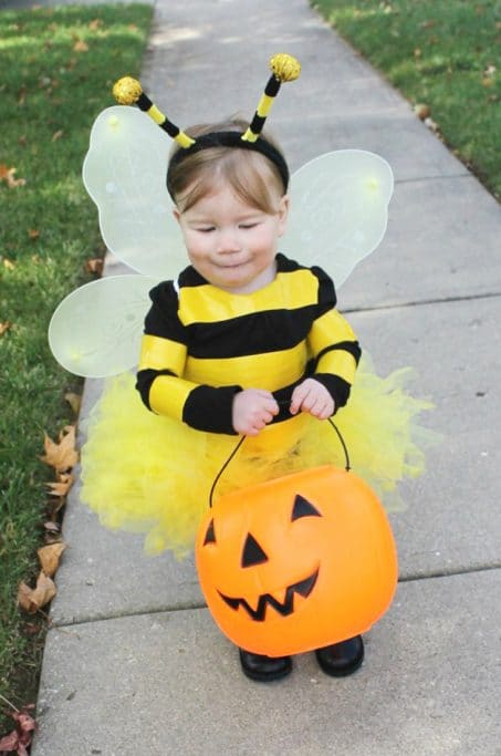 Little girl in DIY bee costume image.