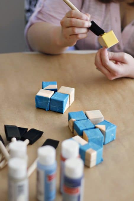Make these easy DIY geometric wood blocks perfect as nursery decor or for baby shower decor. 