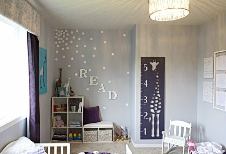Toddler girl's bedroom with purple accents image.