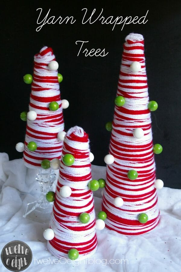 Mini Christmas trees wrapped with red and white yarn image.