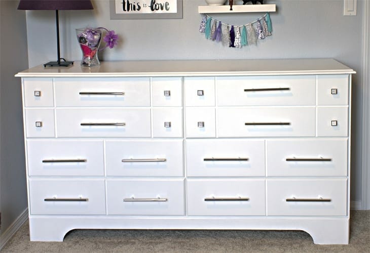 Check out this easy, DIY, glam dresser makeover!! The difference between the before and after is INCREDIBLE and the new hardware is stunning!!