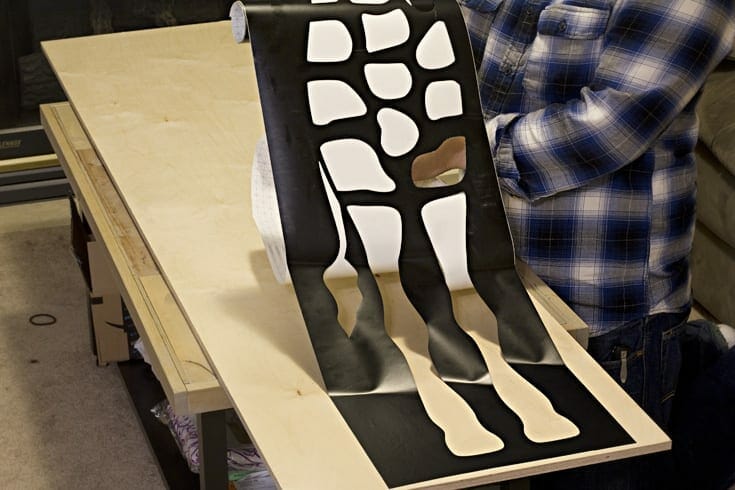 Giraffe shaped vinyl stencil image.