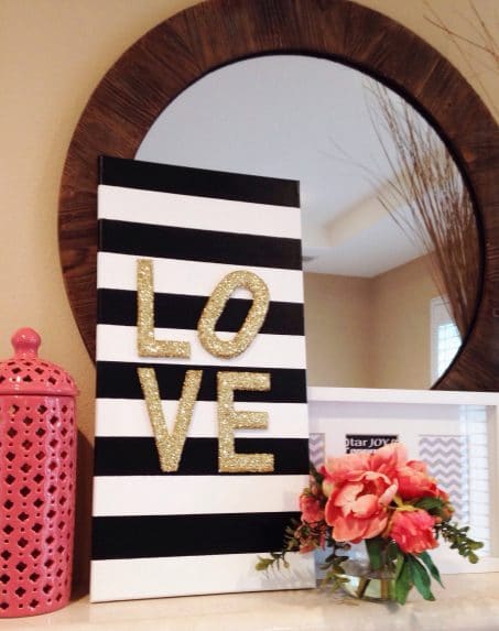 Black and white sign with letters spelling love image.