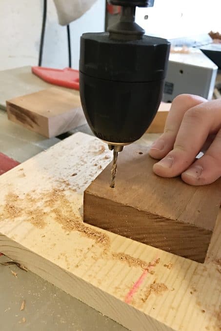 Drilling into a piece of wood image. 