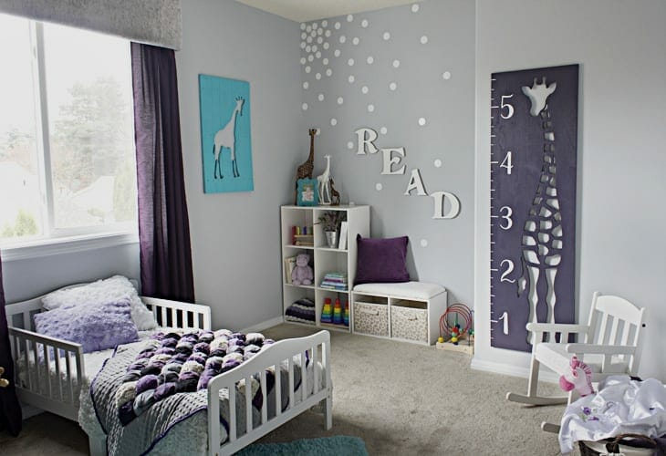 Little girl's bedroom with a feature wall and the word READ image.