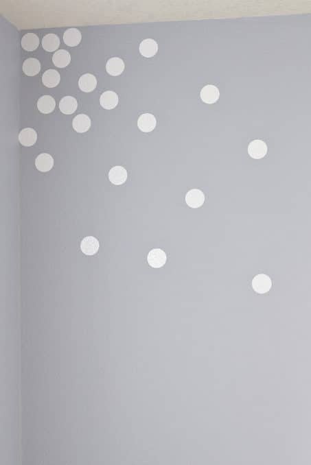 White vinyl circles on a gray wall image.