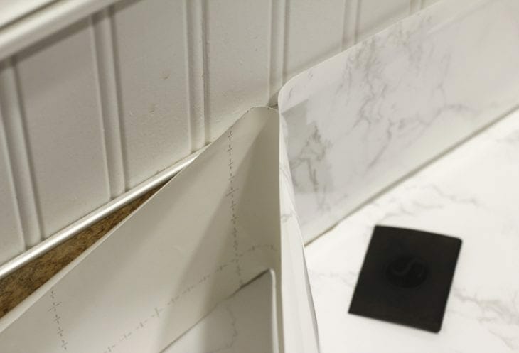 Want an expensive look without the price tag? Makeover your bathroom or kitchen with this faux marble countertops DIY tutorial on a budget.