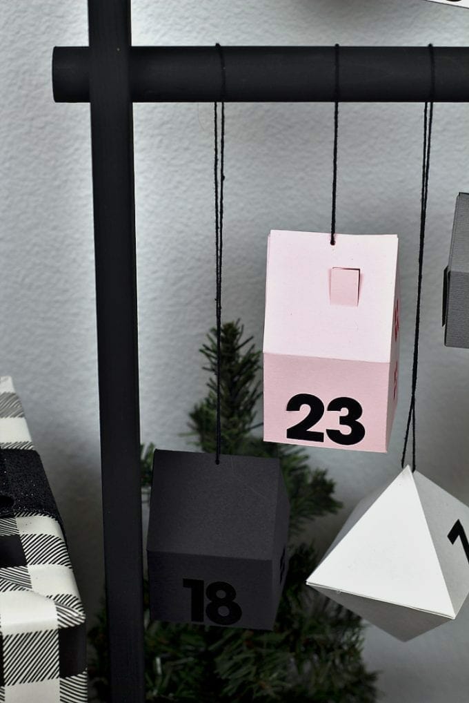 Modern advent calendar with houses and dates image.