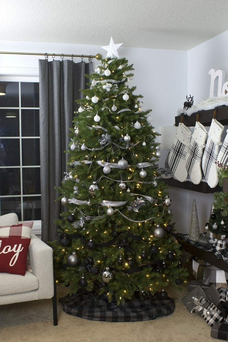 Show off your holiday decor with a gorgeous modern white, silver, and black ombre Christmas tree this year. So many fun Christmas home decor ideas.