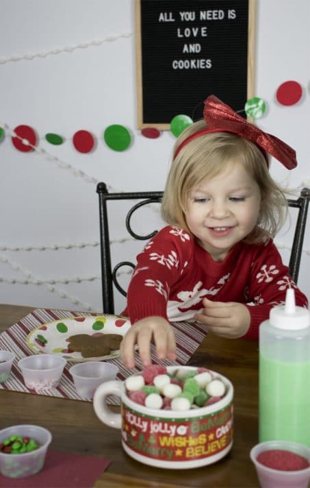 Looking to throw the BEST Christmas cookie decorating party? This is a super fun holiday party idea for kids AND adults and easy to throw together.
