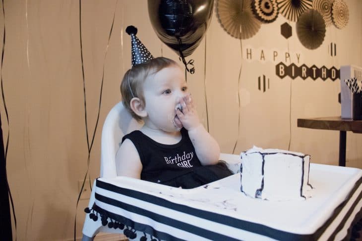 Birthday girl shoving cake in her mouth