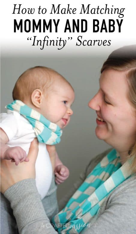 Mom in a scarf smiling holding a baby girl image.