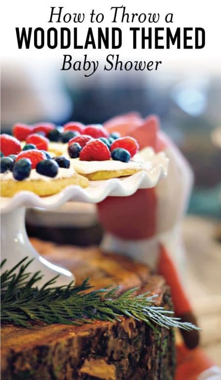 Tart with berries on a white cake stand image.