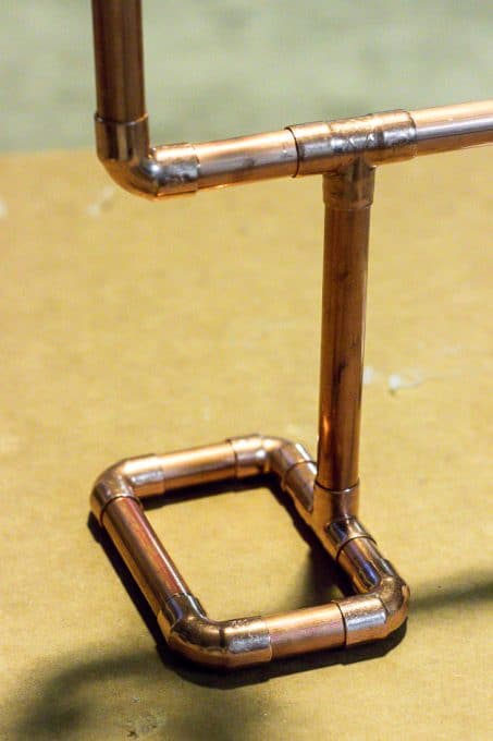 Copper pipes into a necklace holder image