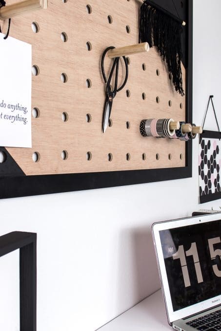 Image of office pegboard next to geometric art