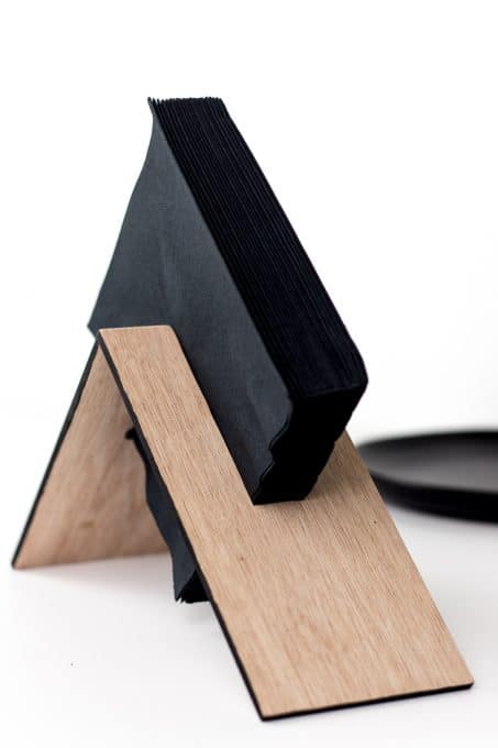 Make a modern wooden napkin holder with this simple DIY tutorial. This asymmetrical design is easy to make and looks great! #diy #build 