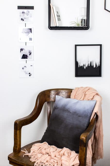 Image of mid-century chair with ombre throw pillow