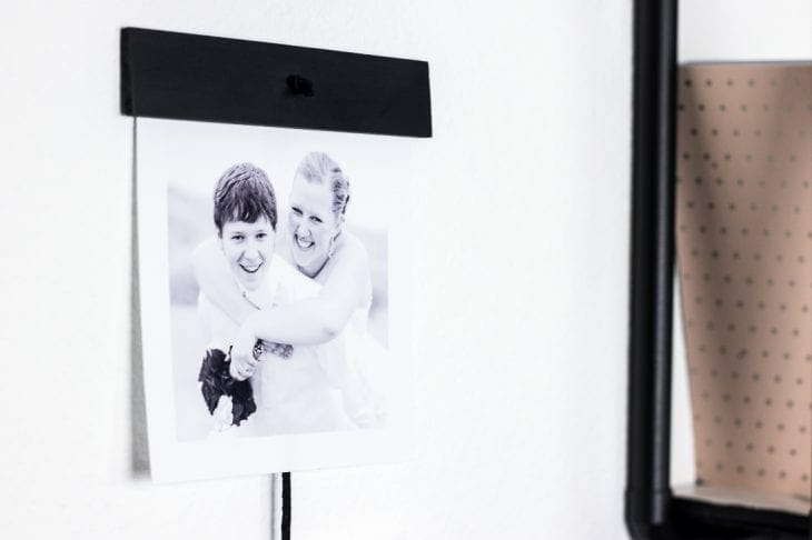 Create this simple pictures wall hanging using just a few items to show off some of your favorite photos.