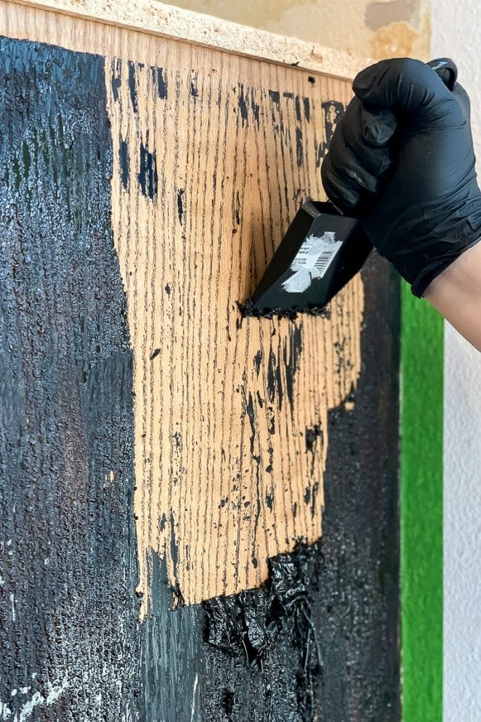 Scraping the paint with scraper.