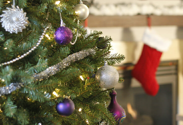 A Silver & Purple Glam Christmas Tree with glittery ornaments with a twist of rustic burlap.