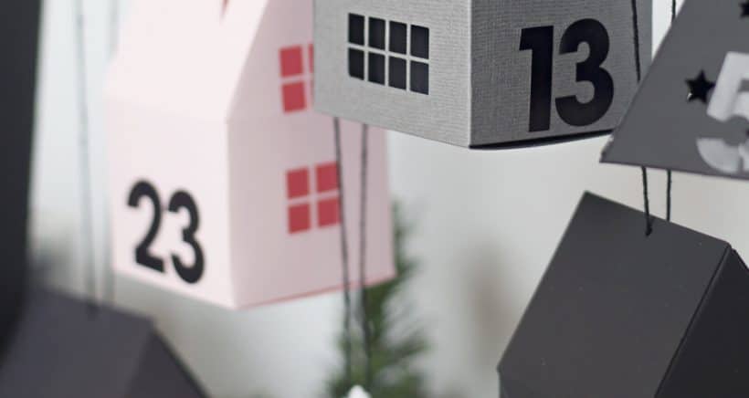 Make a modern advent calendar perfect for toddlers with this little paper village from Lia Griffith filled with activities and fun ideas for Christmas! This DIY ladder is the perfect way to display it all!