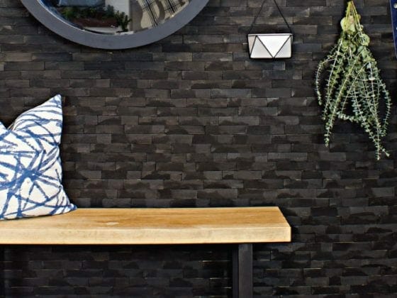 This industrial modern entry includes a mix of DIY projects with a custom wood slab bench and wood shim wall along with simple, modern decor. Check it out for all the details on this entry way.