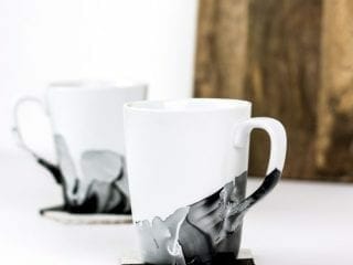 Create marble mugs using nail polish with these simple tips. You can easily make your white coffee cups look like they have been painted with watercolors. #diy #marblemugs