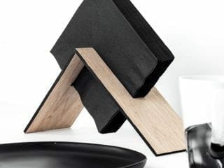 Make a modern wooden napkin holder with this simple DIY tutorial. This asymmetrical design is easy to make and looks great!