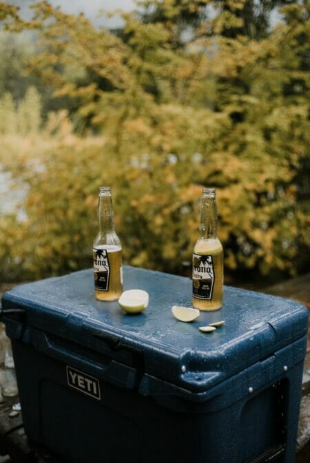 corona extra beer bottle on black wooden table