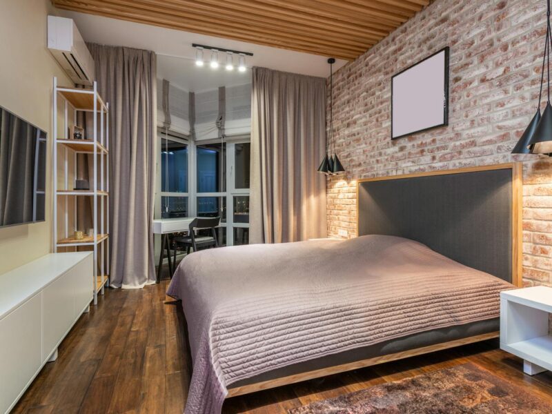 Bedroom interior with furniture and TV in flat